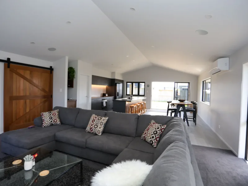 Modern Coastal home with large covered outdoor entertaining area in Cooks Beach